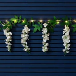 Solar Powered 180cm Artificial Leaf Garland With Wisteria Flowers - Warm White 6 Solar Powered 180cm Artificial Leaf Garland With Wisteria Flowers - Warm White -B&M Garden Shop 379258 180cm solar powered artificial leaf garland with wisteria flowers 20 warm white micro leds 3